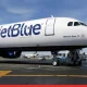 JetBlue Flight Forced into Emergency Landing After Passenger Attempts to Open Emergency Door Mid-Air